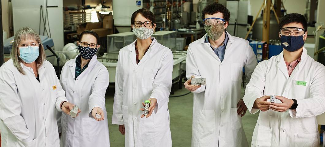 team of researchers in lab coats