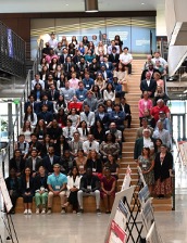 Group photo of students on a wide stair case